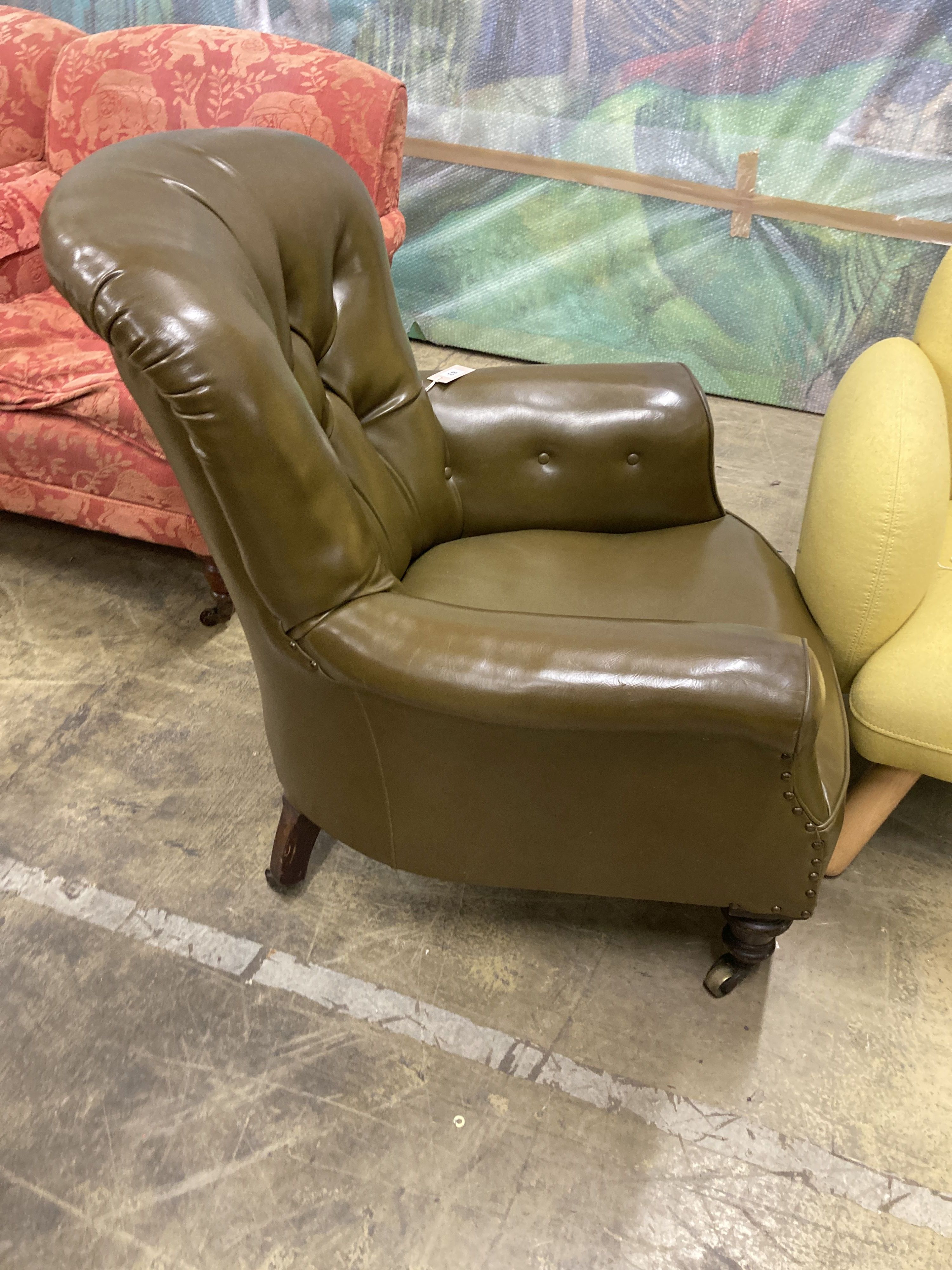 A Victorian library chair upholstered in olive green leather, width 80cm, depth 70cm, height 86cm